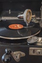 Components of an old gramophone from the company Odeon from Germany in the 1920s with a shellac disc, pickup, a box for the plate Royalty Free Stock Photo