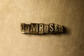 COMPOSED - close-up of grungy vintage typeset word on metal backdrop