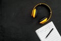 Composer office desk . Workplace of musician with headphones and notes black background top view mockup Royalty Free Stock Photo