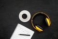 Composer office desk . Workplace of musician with headphones and notes black background top view mockup Royalty Free Stock Photo