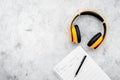 Composer office desk . Workplace of musician with headphones and notes stone background top view mockup Royalty Free Stock Photo