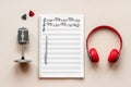 Composer table with music sheets and microphone, top view Royalty Free Stock Photo