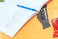 Composer write note of song and use acoustic guitar Royalty Free Stock Photo