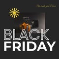 Composite of black friday text and shopping trolley and gift on black background Royalty Free Stock Photo