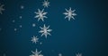 Composite of christmas snow falling over blue background Royalty Free Stock Photo
