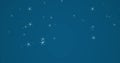 Composite of christmas snow falling over blue background Royalty Free Stock Photo