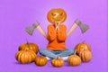 Composite collage of person scary festive pumpkin instead head two axes behind isolated on purple background