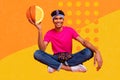 Composite collage portrait of positive person sitting hand hold half basketball orange citrus isolated on creative Royalty Free Stock Photo