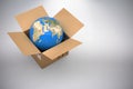 Composite 3d image of image of globe in cardboard box Royalty Free Stock Photo