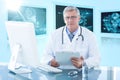 Composite 3d image of portrait of confident male doctor sitting at computer desk