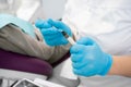 Composite filling material used in dentistry. Dentist& x27;s hands in sterile gloves close-up. Royalty Free Stock Photo