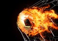 Composite flame effect on 3d rendering black and white patterned soccer ball breaking through the goal net Royalty Free Stock Photo