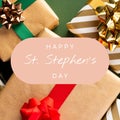 Composite of happy st stephen\'s day text over christmas presents, copy space
