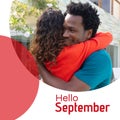 Composite of hello september text over biracial couple embracing