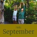 Composite of hello september text over caucaisan couple practicing yoga in garden