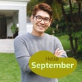 Composite of hello september text over smiling asian man in garden