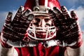 Composite image of american football player in helmet gesturing Royalty Free Stock Photo