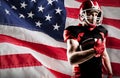 Composite image of american football player in helmet holding rugby ball Royalty Free Stock Photo