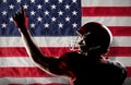 Composite image of american football player in helmet pointing upwards Royalty Free Stock Photo