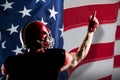 Composite image of american football player in helmet pointing upwards Royalty Free Stock Photo