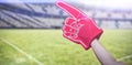 Composite image of american football player holding supporter foam hand 3d Royalty Free Stock Photo