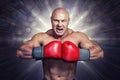 Composite image of angry bald boxer with punching gloves