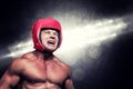 Composite image of angry boxer with headgear Royalty Free Stock Photo