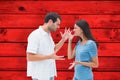 Composite image of angry brunette shouting at boyfriend Royalty Free Stock Photo