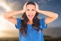 Composite image of angry brunette shouting at camera Royalty Free Stock Photo