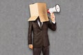 Composite image of anonymous businessman holding a megaphone Royalty Free Stock Photo