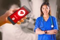 Composite image of asian nurse with stethoscope crossing arms Royalty Free Stock Photo