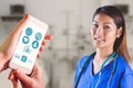 Composite image of asian nurse with stethoscope looking at the camera Royalty Free Stock Photo
