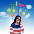 Composite image of asian woman on a phone call Royalty Free Stock Photo