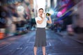 Composite image of astonished elegant businesswoman holding binoculars Royalty Free Stock Photo