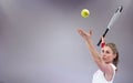 Composite image of athlete holding a tennis racquet ready to serve Royalty Free Stock Photo