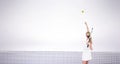 Composite image of athlete holding a tennis racquet ready to serve Royalty Free Stock Photo