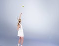 Composite image of athlete holding a tennis racquet ready to serve Royalty Free Stock Photo