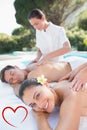 Composite image of attractive couple enjoying couples massage poolside Royalty Free Stock Photo