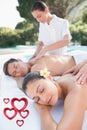 Composite image of attractive couple enjoying couples massage poolside