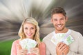 Composite image of attractive couple flashing their cash Royalty Free Stock Photo