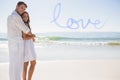 Composite image of attractive couple hugging and looking at camera Royalty Free Stock Photo