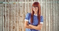 Composite image of attractive hipster woman with crossed arms Royalty Free Stock Photo