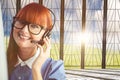 Composite image of attractive hipster woman with headset Royalty Free Stock Photo