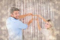 Composite image of attractive young couple hanging a frame Royalty Free Stock Photo