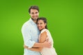 Composite image of attractive young couple hugging and smiling at camera Royalty Free Stock Photo