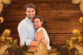 Composite image of attractive young couple hugging and smiling at camera Royalty Free Stock Photo