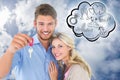 Composite image of attractive young couple showing new house key Royalty Free Stock Photo