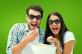 Composite image of attractive young couple watching a 3d movie Royalty Free Stock Photo