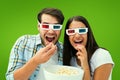 Composite image of attractive young couple watching a 3d movie Royalty Free Stock Photo