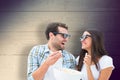 Composite image of attractive young couple watching a 3d movie Royalty Free Stock Photo